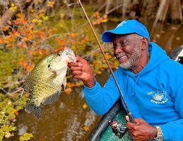 Forrest Green is all smiles with this huge white crappie caught on submerged wood in Caddo Lake. (Photo: Keith Lusher)