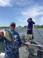 Proof positive cane poles work. Guide Kevan Paul shows off a nice crappie while a client brings in another fish off the bow.
