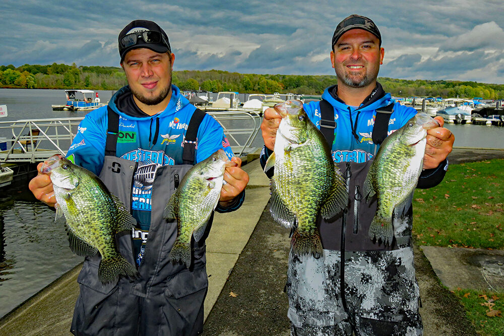 Dan Druschel (left) and Gus Glasgow (right) show off four large crappies from their First Place catch at a Pennsylvania tournament in late summer.