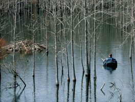 A belly boat, or float tube, provides an excellent means for getting near beaver lodges and other spring crappie hideouts. (Photo: Keith Sutton)