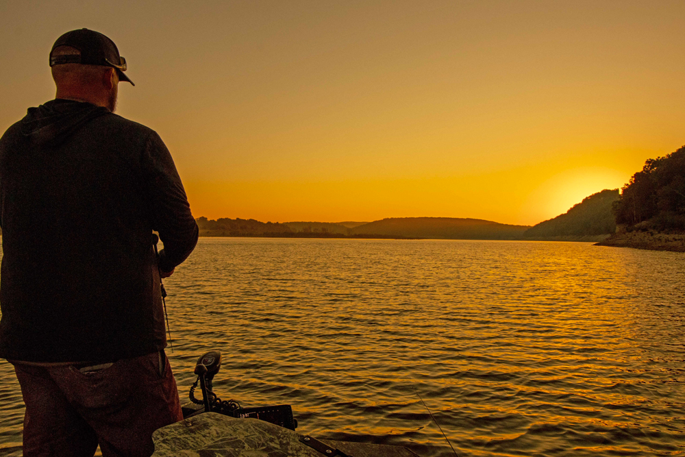 Start your day on the water by enjoying a beautiful sunrise, casting to a brush pile, and anticipating a big fish on the end of your line. It doesn’t get better than this. Jordan Isaacs on upper Bull Shoals Lake in Missouri.