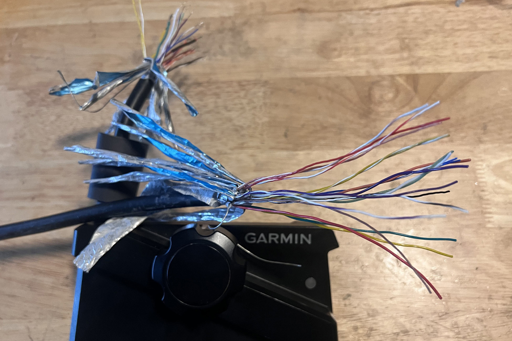 It is amazing and scary to see just how many small wires are required to transmit information from this Garmin transducer to the fishfinder. (Photo courtesy Joey Cook)
