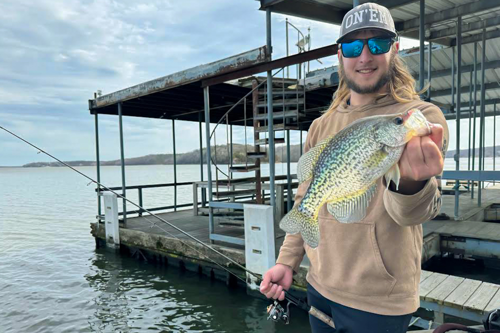 His hat is appropriate as crappie guide Haydn Williams is often “On ‘em” as he fishes boat docks on Grand Lake o’ the Cherokees in Oklahoma to catch big crappies. (Photo: Brent Frazee)