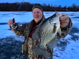 CrappieNOW Editor Richard Simms was proud of his first-ever crappie captured beneath the ice. But the planning for his January adventure began many months before the water turned hard. (Photo: Scott MacKenthun)