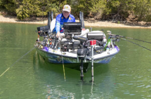 While fishing by himself, David Jones checks out an area by spider rigging. He says it’s still a great way to catch crappie. On a guide trip, his two clients are in the front seats catching fish while he controls the trolling motor by remote and nets fish for them. (Photo: Tim Huffman)
