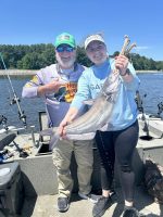 Michael Giles and Audrey Harviel show off a catfish caught during the 2024 CrappieNOW and CatfishNOW Media Camp on Ross Barnett Reservoir.
