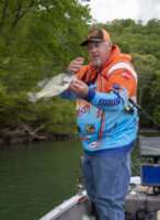 Bailey uses his signature series BnM rod to pitch to mid-depth crappie along a steep bluff. (Photo: Tim Huffman)