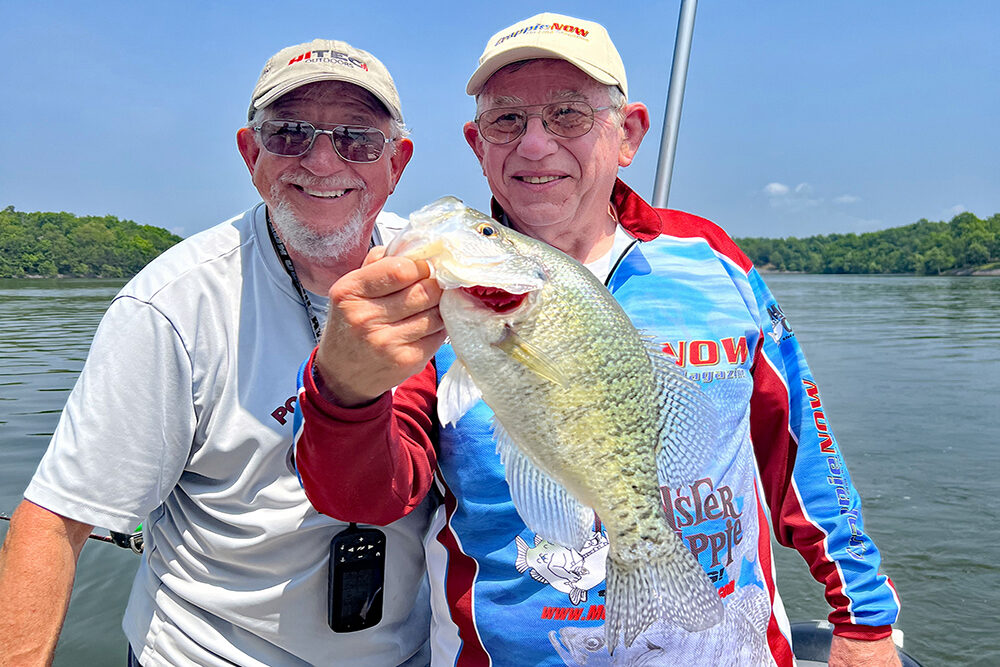 Guide Rich Bay and writer Tim Huffman display a 16.5-inch Kentucky Lake crappie caught by Huffman. Capt. Bay says crankbaits may not catch as many fish as some other methods, but it provides a higher ratio of big crappie.