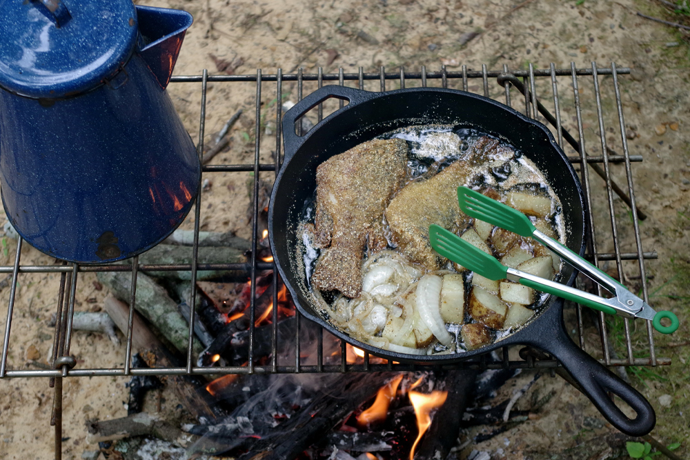 A meal of crappie or other panfish fried with potatoes and onions on the side makes a treat your fishing companions will love. (Photo: Keith Sutton)