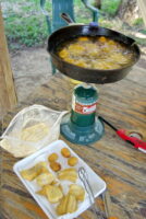 Fish can be cooked over a small propane stove if building a campfire isn’t an option. With a stove, you can prepare lunch quickly and be back on the water fishing in no time. (Photo: Keith Sutton)