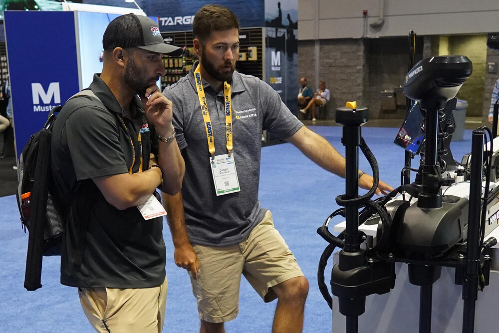 Anglers check out the new MEGA LIVE Imaging TargetLock at the recent ICAST show in Orlando, Fla. Humminbird says anglers can lock on, fish on with the push of a button. (Photo: Brad Wiegmann)