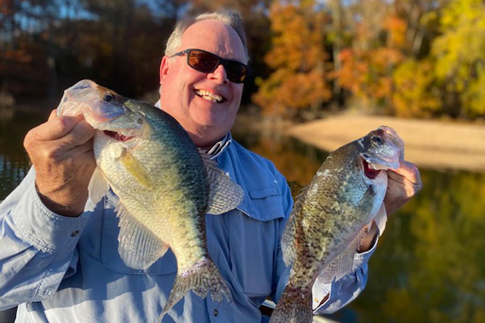 Andy Gass is understandably all smiles with a pair of slabs caught on Tennessee’s Kentucky Lake as the fall colors begin to shine in October. (Photo: Steve McCadams)