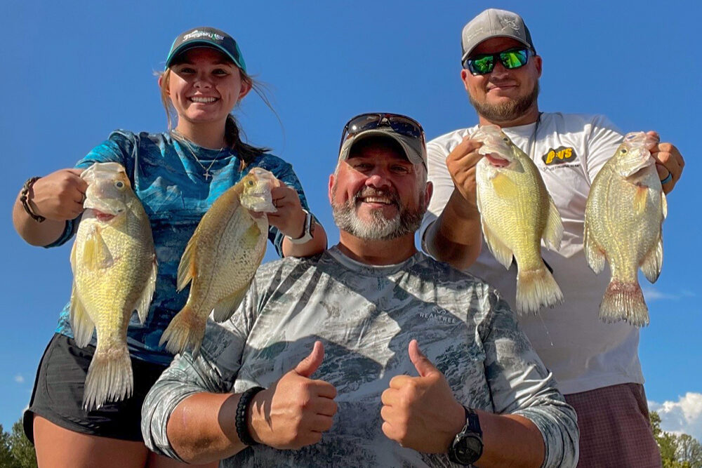 Lindsey Lucas, her Dad, Kody Lucas and Guide Jordan Issacs show off some of the crappie caught on Bull Shoals Lake recently. Unfortunately, not pictured is “The one that got away.”