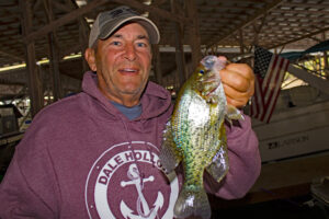 Denny Wilbert, owner of the Dale Hollow Marina, doesn't miss too many mornings coaxing a few crappie from beneath the hundreds of boat slips in his marina. "I've got most of them named," said Wilbert with a grin. "They know I'm usually going to let them go." (Photo: Richard Simms)