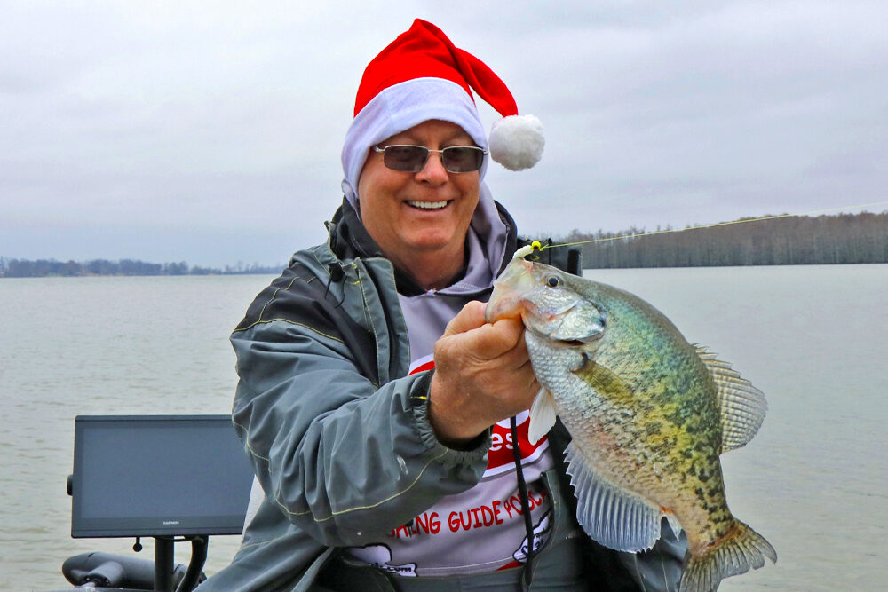mitch from pico lures holding a crappie fish