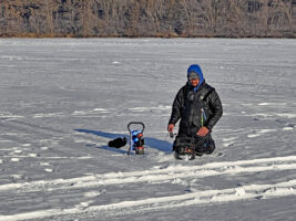 If you’re running and gunning from one ice hole to another in search of fish, warm durable kneepads are an essential piece of whatever coveralls you choose. (Photo: Richard Simms)