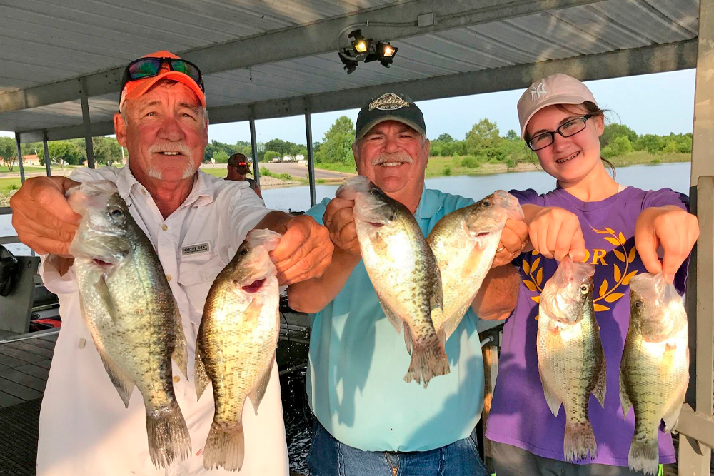 Veteran guide Steve Blake, the author, and his granddaughter, Caty Franklin, were all smiles after a successful trip on Truman Lake in Missouri.