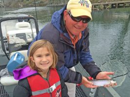 A little fish produced a big grin when Steve Dickey guided the author and his granddaughter, Chloe Franklin, to trout on Lake Taneycomo in Missouri. (Photo: Brent Frazee)