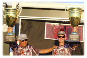 •11012021crappie_masters1.jpg - Trophy time and a round of applause for champions T.J. and Alex Palmer.