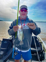 Tim Howell holding a crappie he caught by pulling crankbaits in Mississippi.