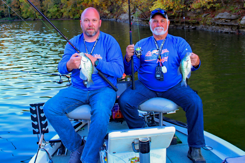 Steve Jeffers (right) fishing with Allen Reed in Kentucky. The fall colors indicate one of the prime times to pinpoint crappie in shallow water. Fish can be caught year-round, but fall and spring are the best times for the approach.