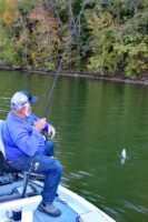 Steve Jeffers maneuvers a crappie he caught spider rigging in shallow water.