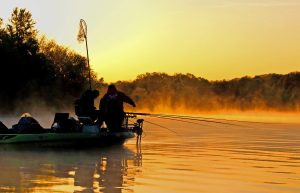 An early, cold winter morning with baits in the water, moving onto a long point, with great anticipation of a successful fishing day. A beautiful daybreak starts the day off right. 