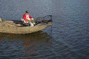 Slow-trolling along a travel corridor covers water and keeps baits in front of crappie that are steadily shifting toward the spawning flats.