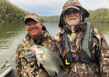Guide Corey Thomas (left) says using planer boards has dramatically improved his crappie trolling success, especially in the clear waters of Dale Hollow Lake.