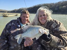 Steve Coleman gives Lisa Weakley a lesson in maneuvering the telescopic B’n’M Ambush rod. She proved to be a quick study, as in a few short hours, Lisa came up with the big fish for the weekend. (Photo by Madalyn Roberts)