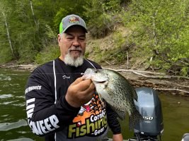 Dean McCoy with a nice crappie taken by casting a free-fall jig over a submerged tree top. (Photo: Tim Huffman)
