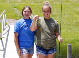 The “Reel Deal” CrappieNow writer, Lindsey Lucas (left), helped with a fishing event while attending the SEOPA Conference in West Virginia. , to teach kids how to fish. Teaching other how to simply bait a hook, cast, see a bite and set the hook are lessons that will lead to other fish for years to come.