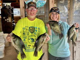 Crappie angler Donnie McCormick and CrappieNOW author Anietra Hamper showcase some of their morning catch on the St. Johns River.Photo credit: Ian Henderson 