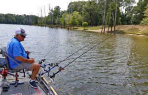 Dan Dannenmueller’s setup from the front of the boat provides an easy-to-use system for set-up and running of a four-pole planer board system out each side of the boat. Strong Driftmaster rod holders, BnM Heaton Saltwater rods and Off Shore planer boards are key items of his technique. (Photo: Tim Huffman)