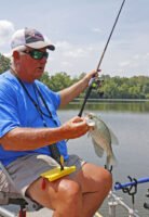 A planer board system is a good way to work a big flat, the edge of a channel or the outside area of a tree line while oxbow crappie fishing. Crappie will quickly show which depths and areas are best. (Photo: Tim Huffman)