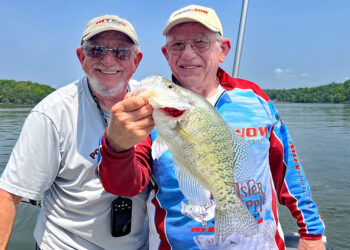Guide Rich Bay and writer Tim Huffman display a 16.5-inch Kentucky Lake crappie caught by Huffman. Capt. Bay says crankbaits may not catch as many fish as some other methods, but it provides a higher ratio of big crappie.