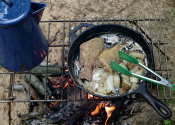 A meal of crappie or other panfish fried with potatoes and onions on the side makes a treat your fishing companions will love. (Photo: Keith Sutton)