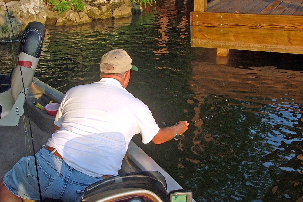 It can take practice to learn how to slingshot a crappie jig beneath a dock that is just a few inches off the water. But perfect the technique and it can be a sure-fire way to connect with crappie in September. (Photo: Richard Simms)