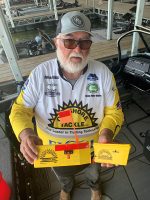 Kentucky Lake guide Doug Wynn with an Off Shore planer board. Only a handful of anglers consider trolling for crappie, but this can be one of the best methods for rousting late summer slabs.