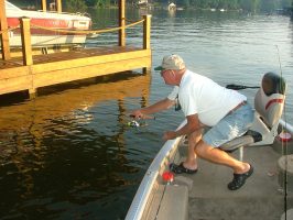 In the summer Dickey Porter knows that boat docks, especially those close to deep water, turn into crappie havens. Those who are proficient at “shooting docks” can usually put some crappie in the livewell. (Photo: Richard Simms)