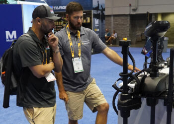Anglers check out the new MEGA LIVE Imaging TargetLock at the recent ICAST show in Orlando, Fla. Humminbird says anglers can lock on, fish on with the push of a button. (Photo: Brad Wiegmann)