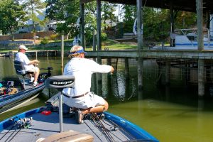 Shady water beneath docks acts like a crappie magnet, especially when the sun is high and temperatures are warm. Dock shooting allows the presentation of jigs in the narrow confines beneath these structures. (Photo: Keith Sutton)