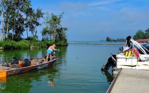 Russ Bailey prepares to “shoot” beneath a pontoon on a northern canal lake, targeting shallow crappie tucked into hard-to-reach cover. (Photo courtesy Russ Bailey)