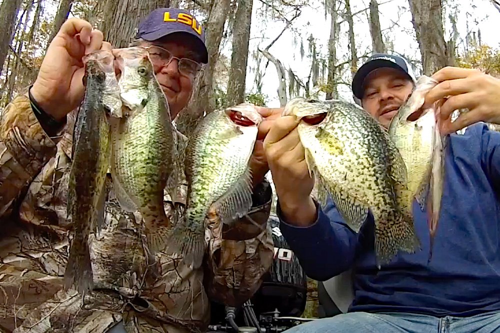 Miller and Lusher are feeling the spirit of Christmas after a cold day of catching Christmas Tree Crappie