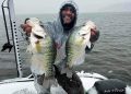 Nothing says winter fishing like an Indiana snowstorm! Ozark Rods pro-staff angler Dante Sezer shows off two crappie taken during a winter storm in Indiana. (Photo courtesy of Dante Sezer)