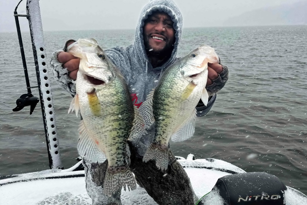 Nothing says winter fishing like an Indiana snowstorm! Ozark Rods pro-staff angler Dante Sezer shows off two crappie taken during a winter storm in Indiana. (Photo courtesy of Dante Sezer)