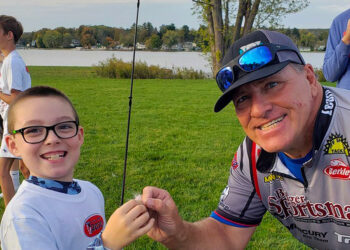 Capt. Greg Karch with one of the obviously happy participants of this year’s Learn 2 Fish With Us clinics. (Contributed Photo)