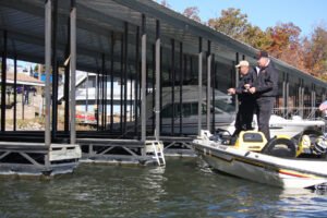 Winter is a good time to find crappie hanging out around docks and marinas. Marina crappie will likely be in tight places along walkways. At private docks, look for brush piles inside the dock and within casting range of the dock. (Photo: Tim Huffman)