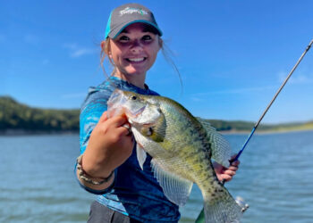 Lindsey Lucas shows off a respectable white crappie. While not extremely distinct, one way to distinguish white crappie from black crappie is the pattern of vertical bars or stripes on the side. Read more to learn about the different types of crappie!