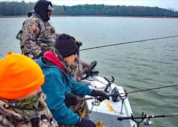 Bundled up against winter’s cold, the author’s fishing party enjoys the season’s peace while waiting for a bite on Arkansas’ Lake Greeson. (Photo: Keith Sutton) Cold Days on Quiet Waters